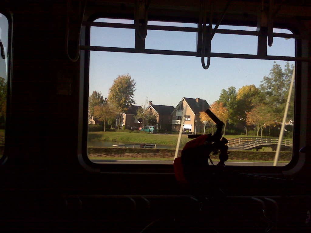 Train, bike, landscape with canals