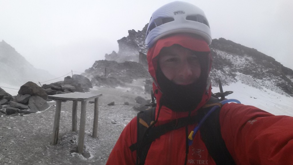 At Camp Muir in below freezing weather. The wind was blistering cold. I know, the hood goes over the helmet, but it was too cold to adjust it at 9000 ft.