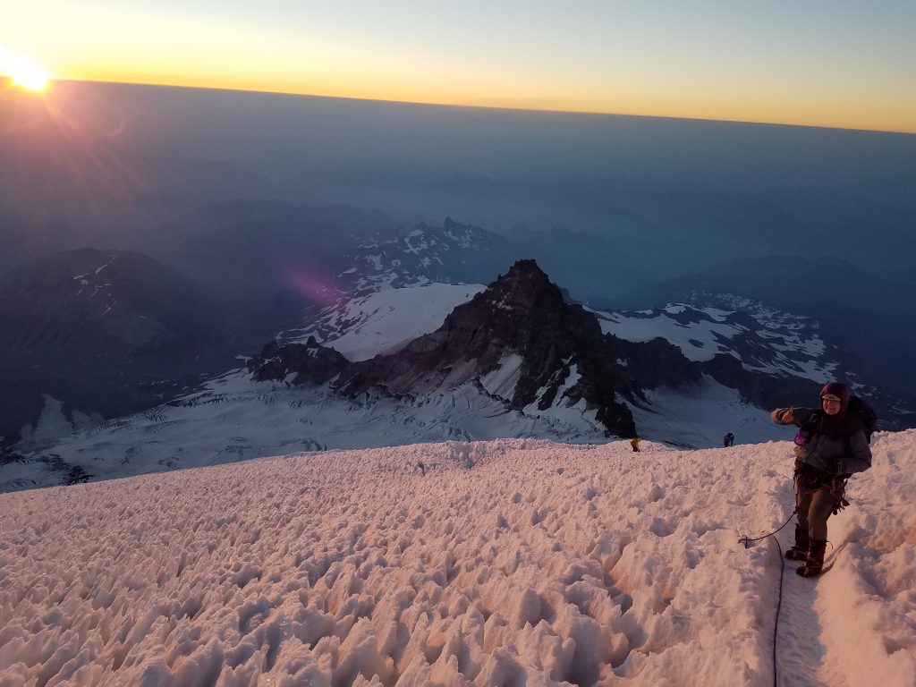 Mountaineers and penitentes at sunrise on Mount Rainier.