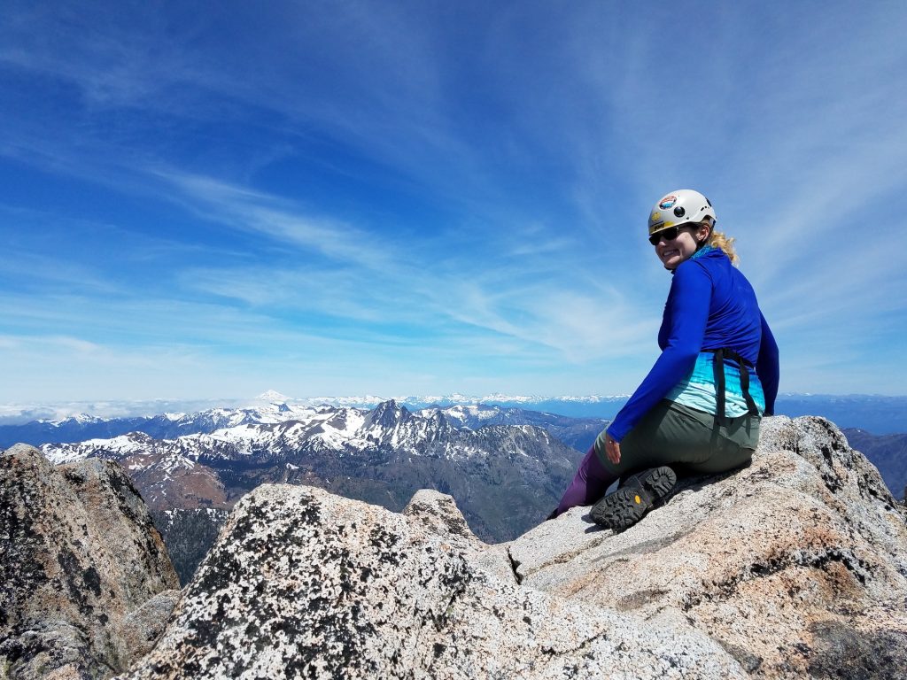 Jenny enjoying the summit. Glacier Peak in the background.